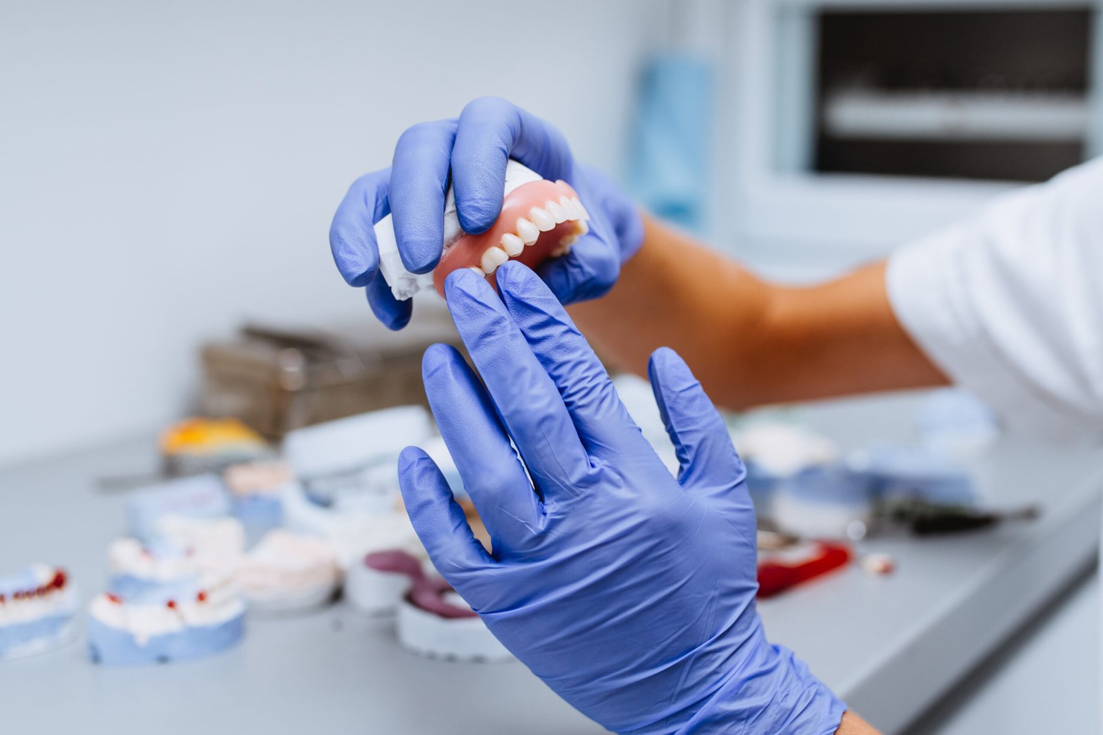 Denture-Design-Pocatello-4 Dental Technician Holding Dentures