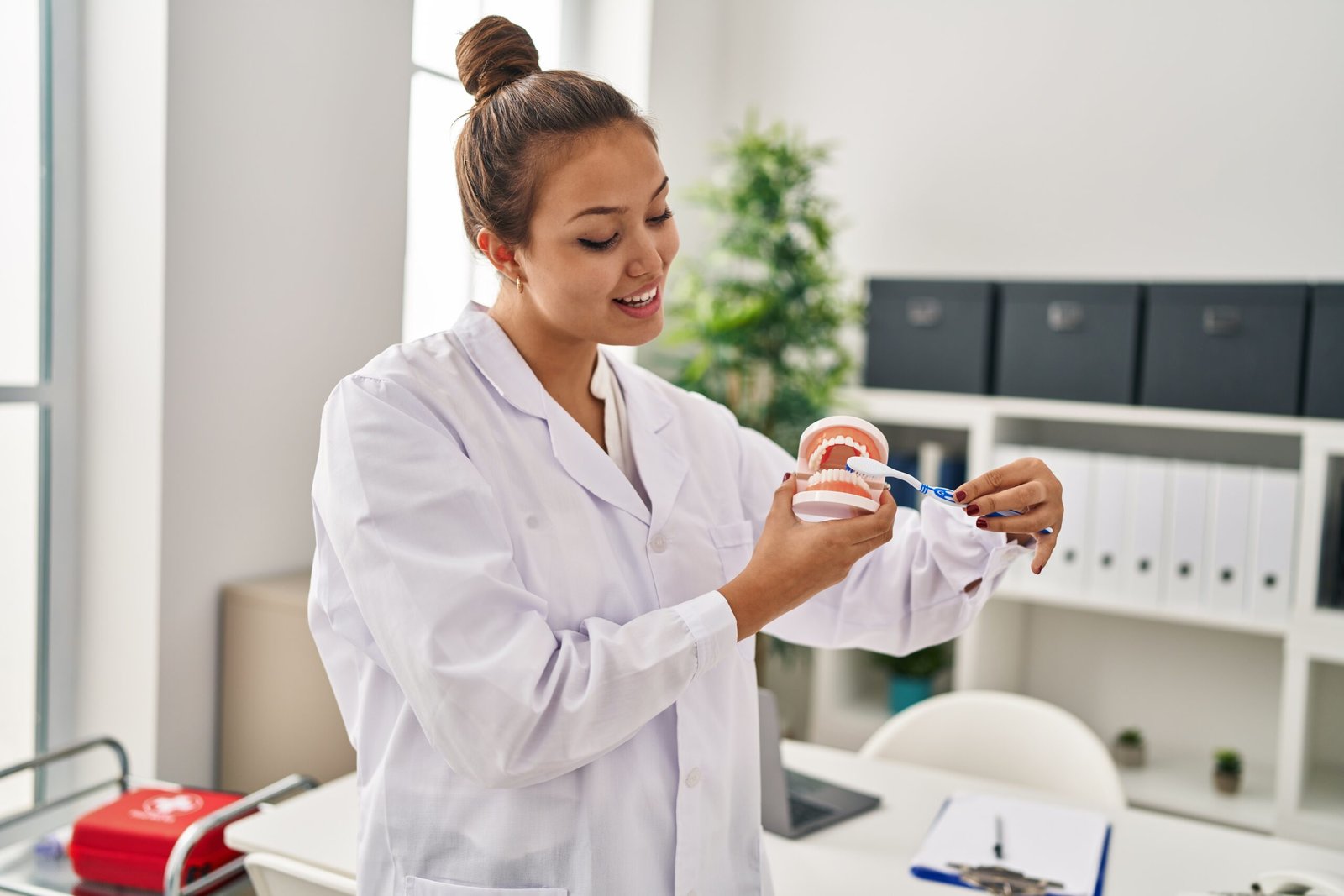 Woman Cleaning Dentures