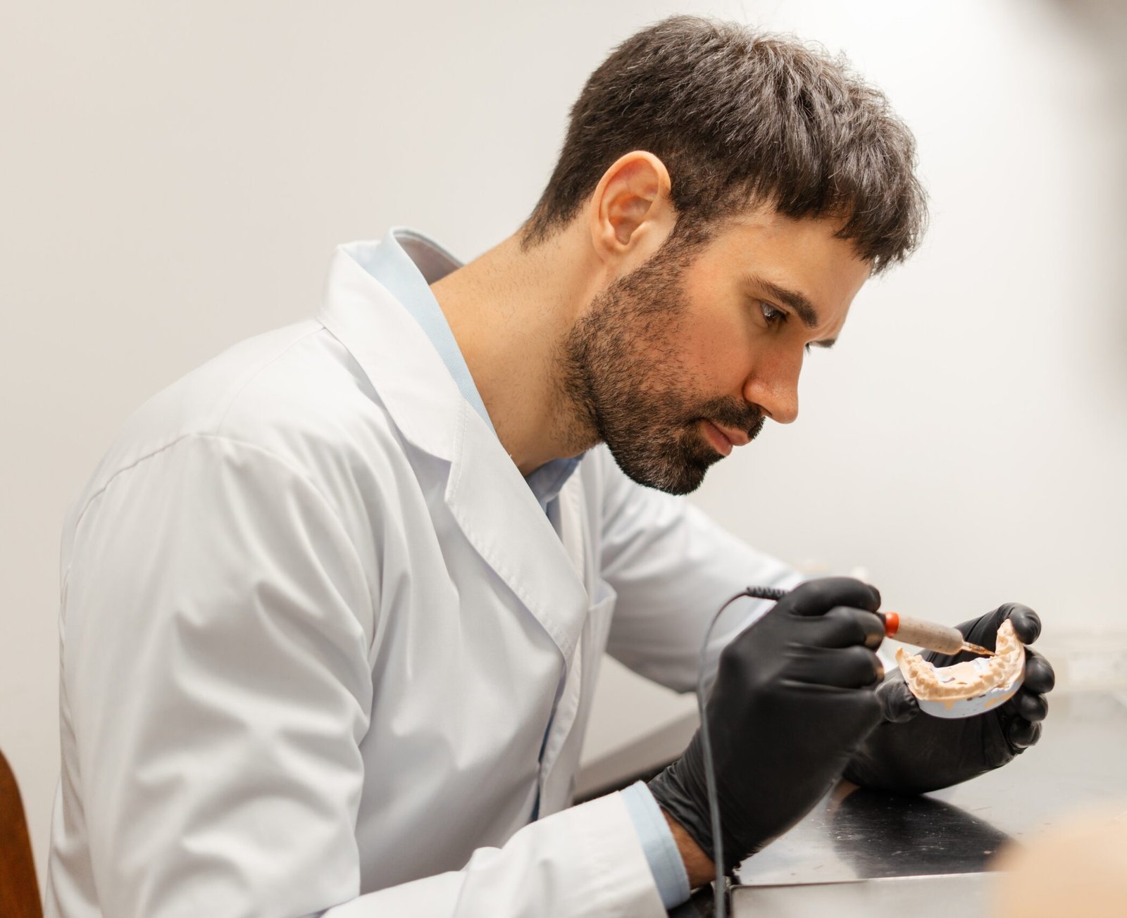 Denturist Working on Dentures