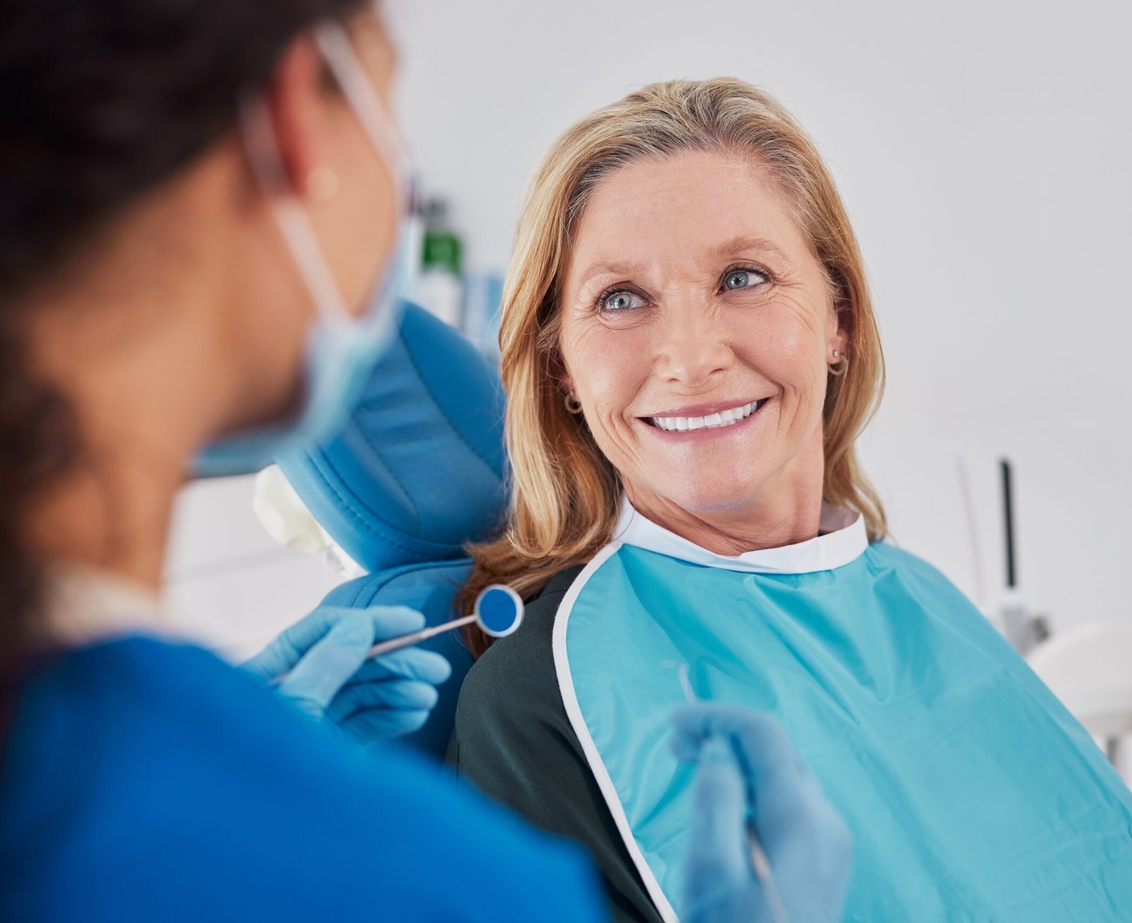 Woman Smiling at Denturist